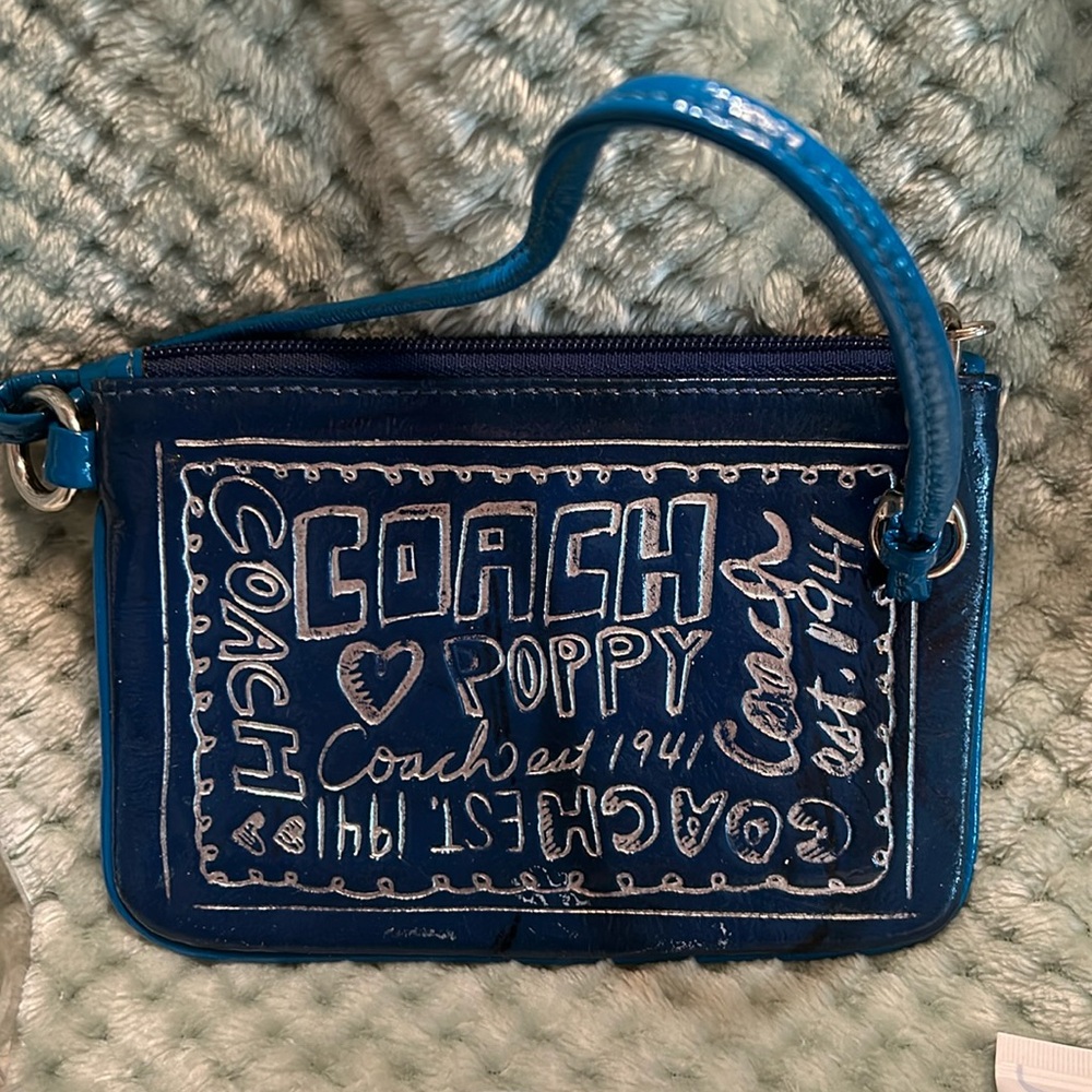 Coach poppy wristlet, Guerlain cosmetic bag with beauty items